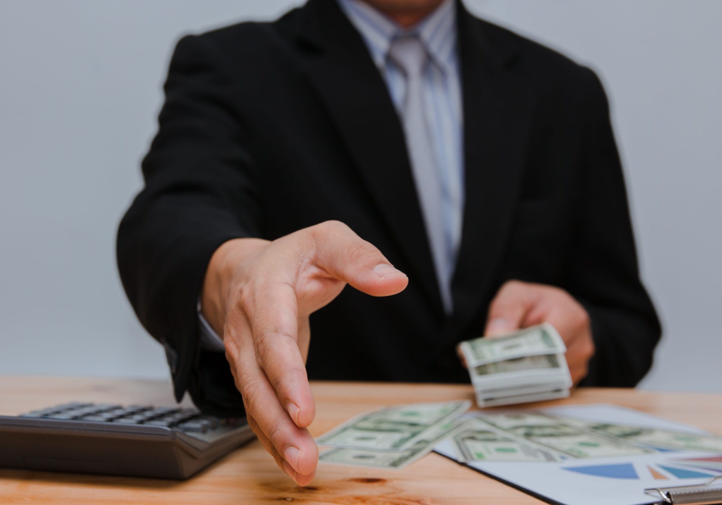 man counting money at the table